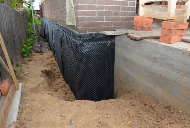 Happy homeowners after waterproofing job in Atmore